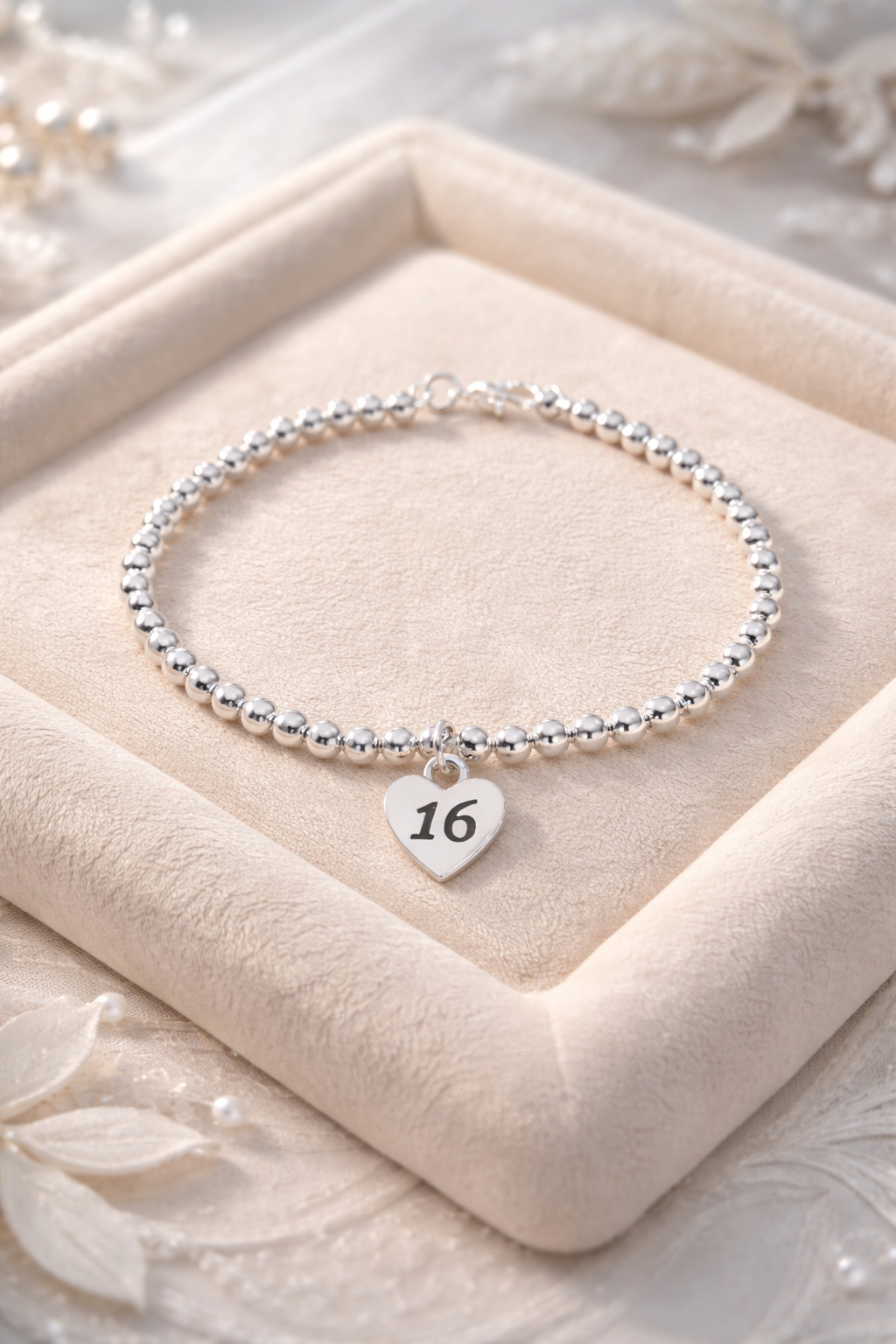 16th birthday keepsake bracelet on a soft velvet background