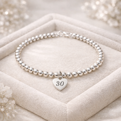 30th birthday keepsake bracelet on a soft velvet background