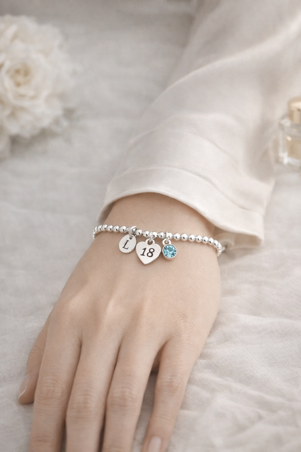 Meaningful personalised 18th birthday jewellery gift with initial and birthstone charm